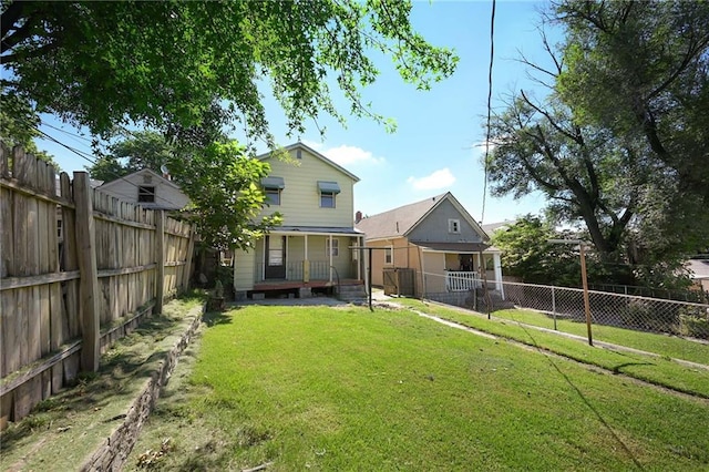 422 N Thompson St, Kansas City, KS 66101 - back of house featuring a fenced backyard