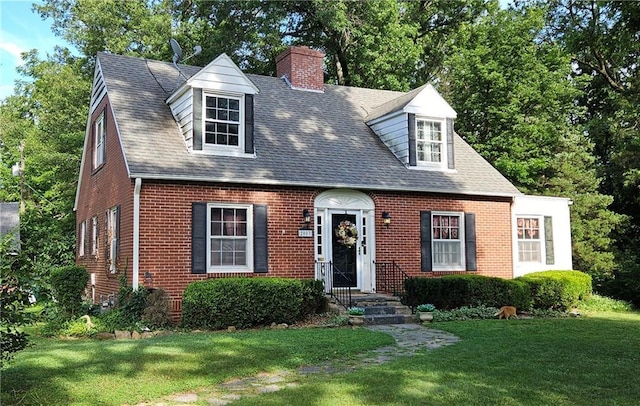 2003 S Elm St, Pittsburg, KS 66762 - cape cod home with brick siding, a front yard, a chimney, and a shingled roof