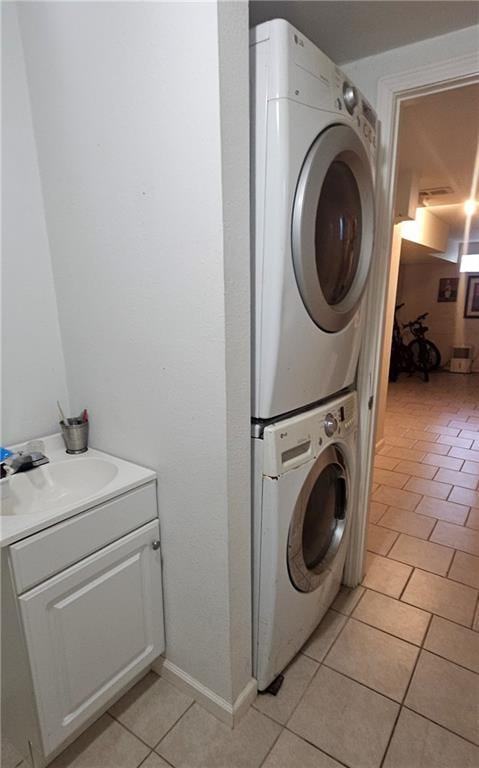 2003 S Elm St, Pittsburg, KS 66762 - laundry room with estacked washer and dryer and light tile patterned flooring