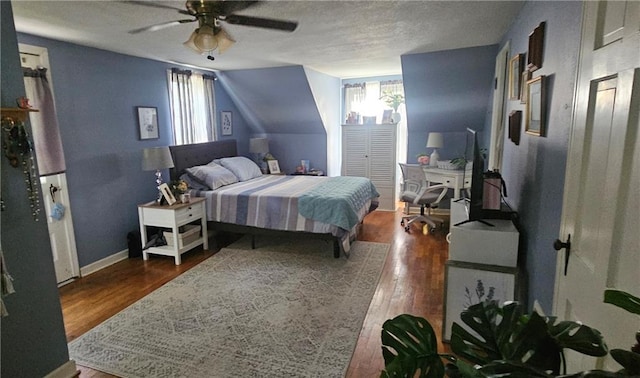 2003 S Elm St, Pittsburg, KS 66762 - bedroom with wood finished floors, a desk, a ceiling fan, a textured ceiling, and vaulted ceiling
