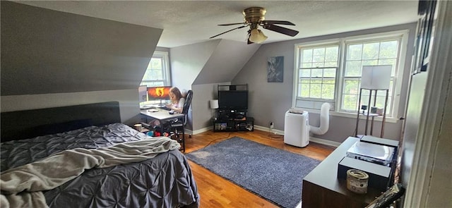 2003 S Elm St, Pittsburg, KS 66762 - bedroom with multiple windows, wood finished floors, lofted ceiling, and ceiling fan