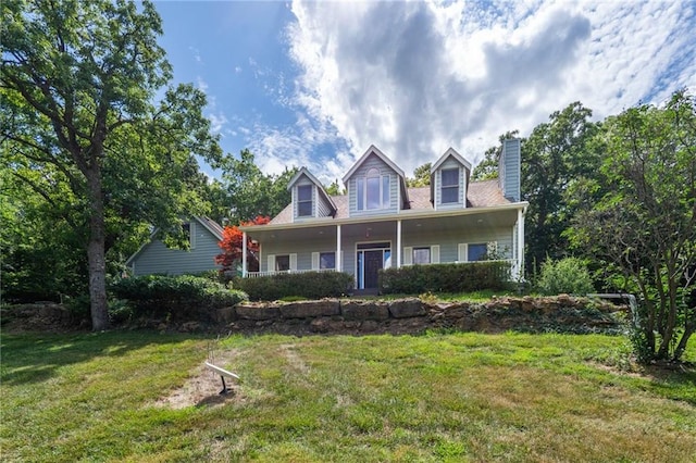 731 E 1100th Rd, Baldwin City, KS 66006 - cape cod-style house with a front yard and a chimney