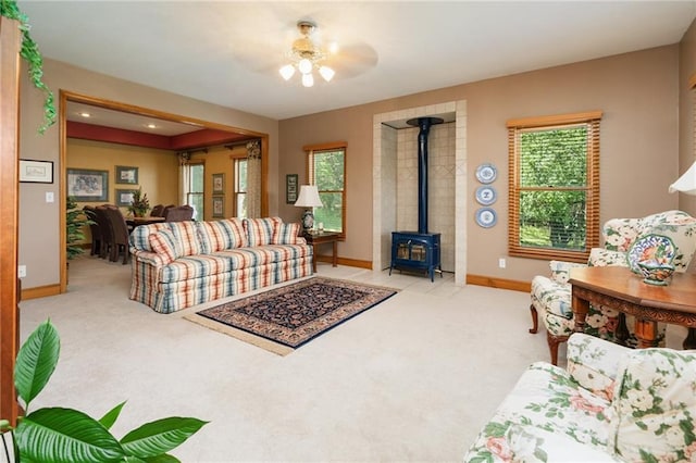 731 E 1100th Rd, Baldwin City, KS 66006 - living area with carpet floors and a wood stove
