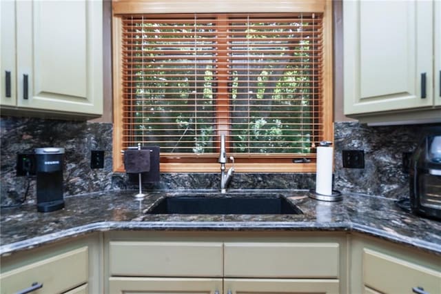731 E 1100th Rd, Baldwin City, KS 66006 - kitchen featuring backsplash and dark stone countertops