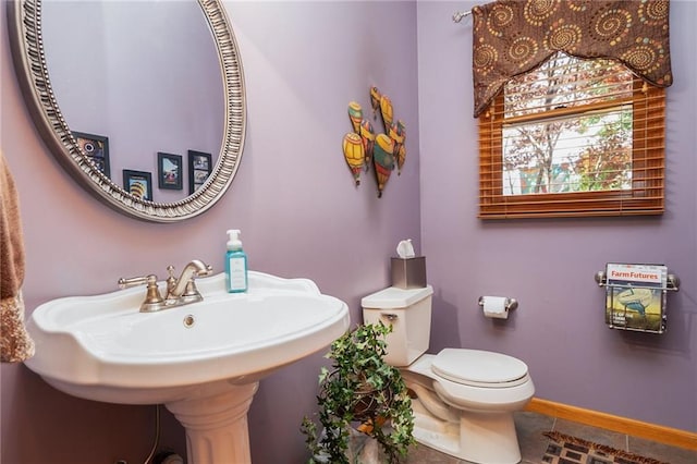 731 E 1100th Rd, Baldwin City, KS 66006 - half bathroom with tile patterned floors and toilet