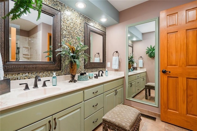 731 E 1100th Rd, Baldwin City, KS 66006 - full bathroom featuring double vanity, a shower, tile patterned floors, and decorative backsplash