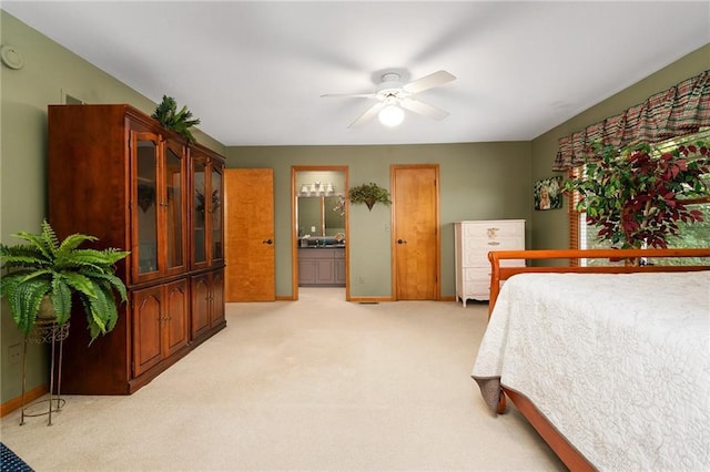 731 E 1100th Rd, Baldwin City, KS 66006 - bedroom featuring light colored carpet, ceiling fan, and connected bathroom