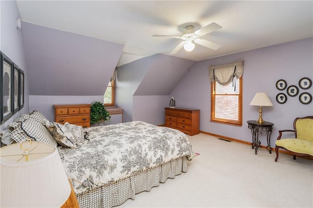 731 E 1100th Rd, Baldwin City, KS 66006 - carpeted bedroom featuring multiple windows, lofted ceiling, and a ceiling fan