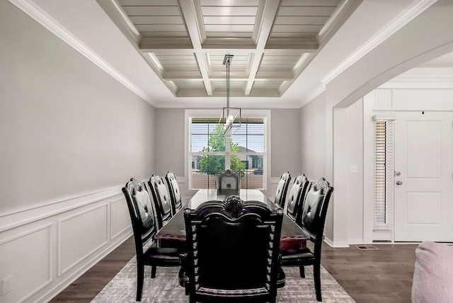 24322 W 58th Cir, Shawnee, KS 66226 - dining space with coffered ceiling, dark wood-style flooring, beamed ceiling, ornamental molding, and arched walkways