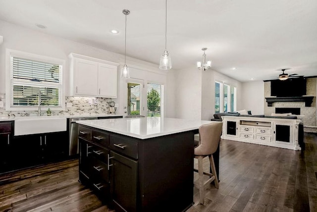 24322 W 58th Cir, Shawnee, KS 66226 - kitchen featuring white cabinetry, light countertops, dark wood finished floors, open floor plan, and recessed lighting
