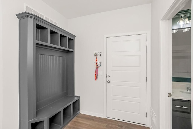 24322 W 58th Cir, Shawnee, KS 66226 - mudroom featuring dark wood-style floors and baseboards