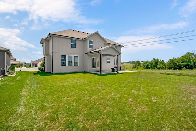24322 W 58th Cir, Shawnee, KS 66226 - rear view of property with a patio area and a lawn