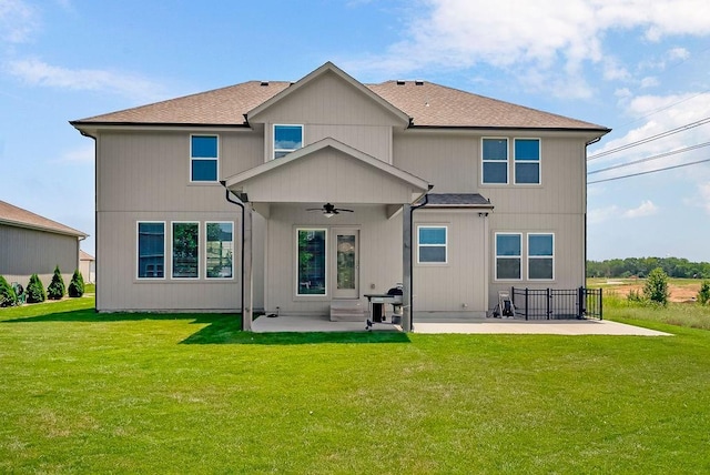 24322 W 58th Cir, Shawnee, KS 66226 - back of house with a ceiling fan, a patio, and a yard