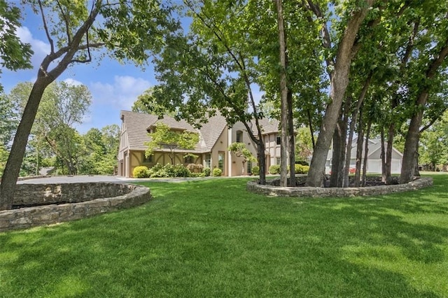 8320 Maplewood Ln, Lenexa, KS 66215 - view of green lawn with a garage