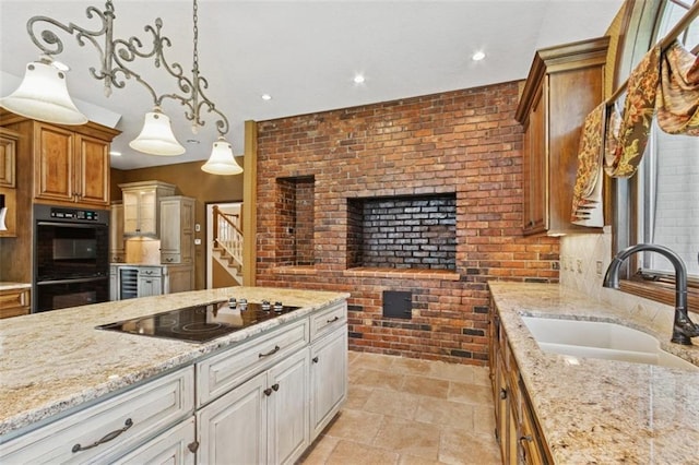 8320 Maplewood Ln, Lenexa, KS 66215 - kitchen featuring black appliances, light stone countertops, brick wall, light stone finish flooring, and recessed lighting