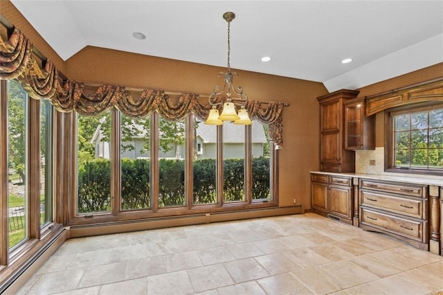 8320 Maplewood Ln, Lenexa, KS 66215 - unfurnished dining area featuring a chandelier, a baseboard radiator, lofted ceiling, healthy amount of natural light, and recessed lighting