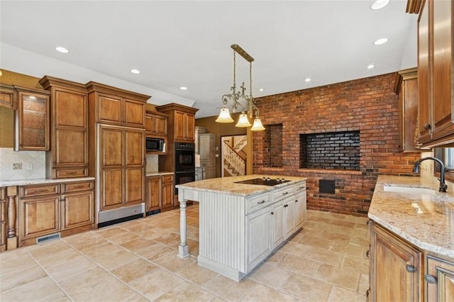 8320 Maplewood Ln, Lenexa, KS 66215 - kitchen with black appliances, recessed lighting, a breakfast bar area, brown cabinets, and tasteful backsplash