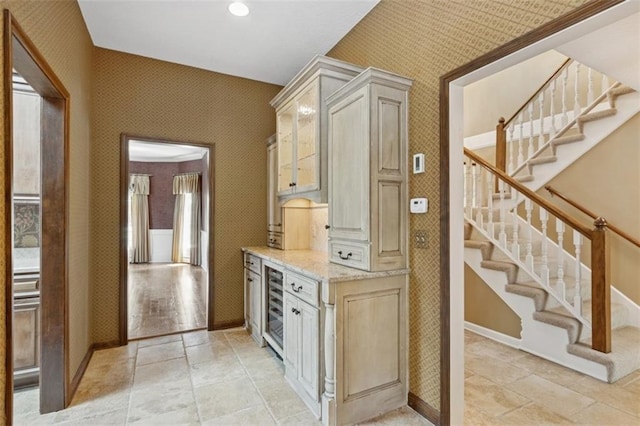 8320 Maplewood Ln, Lenexa, KS 66215 - corridor featuring wallpapered walls, beverage cooler, stairs, and recessed lighting