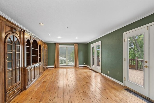 8320 Maplewood Ln, Lenexa, KS 66215 - unfurnished living room with french doors, crown molding, healthy amount of natural light, light wood-style floors, and recessed lighting