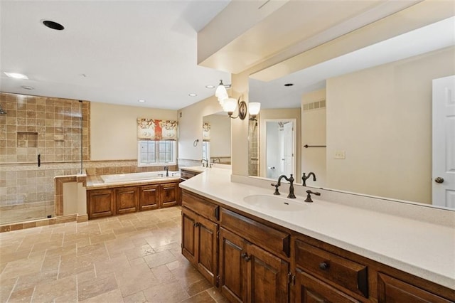 8320 Maplewood Ln, Lenexa, KS 66215 - full bathroom with vanity, a bath, a stall shower, tile walls, and stone tile flooring
