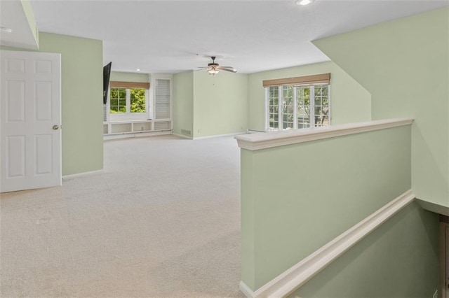 8320 Maplewood Ln, Lenexa, KS 66215 - spare room featuring ceiling fan, carpet floors, and recessed lighting