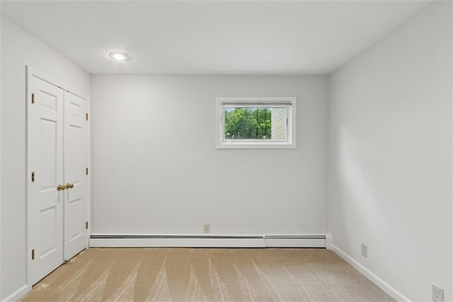 8320 Maplewood Ln, Lenexa, KS 66215 - unfurnished bedroom with carpet floors and a baseboard heating unit