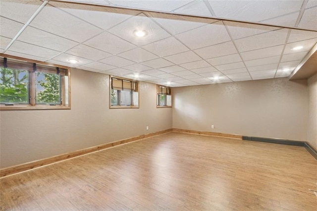 8320 Maplewood Ln, Lenexa, KS 66215 - basement with wood finished floors and a paneled ceiling