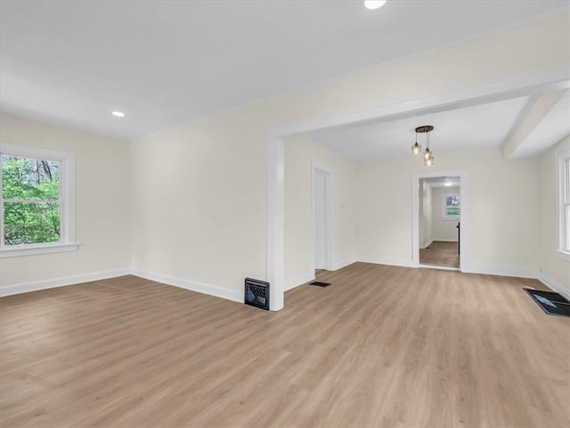 3928 E 58th St, Kansas City, MO 64132 - empty room featuring light wood-style floors and recessed lighting