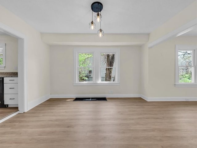 3928 E 58th St, Kansas City, MO 64132 - unfurnished dining area with light wood-style floors