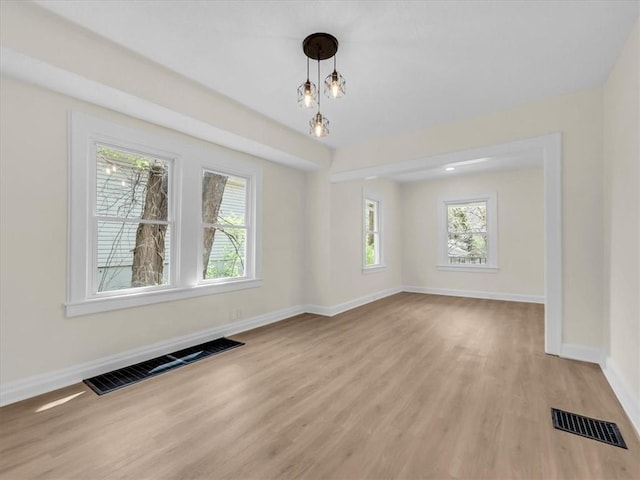 3928 E 58th St, Kansas City, MO 64132 - unfurnished room featuring baseboards and light wood finished floors
