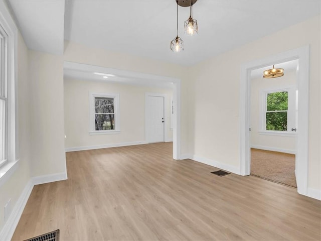 3928 E 58th St, Kansas City, MO 64132 - empty room with baseboards and light wood finished floors