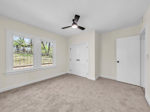 3928 E 58th St, Kansas City, MO 64132 - unfurnished bedroom with carpet floors and ceiling fan