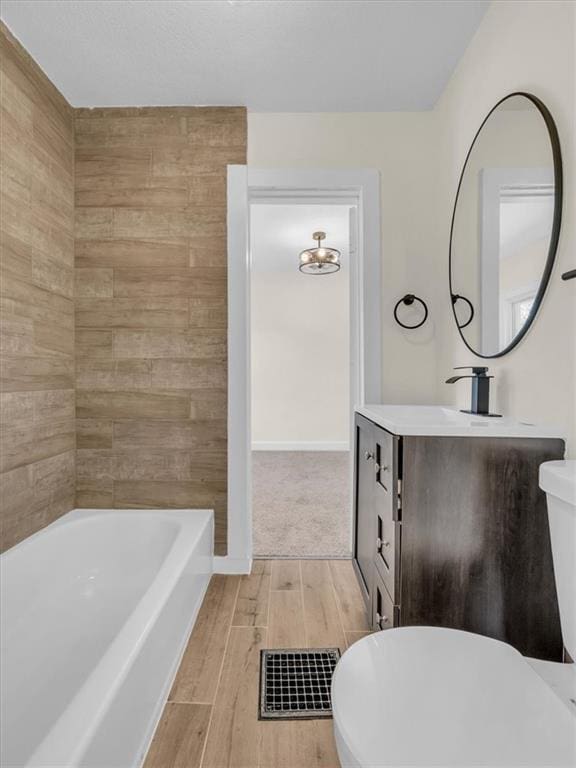 3928 E 58th St, Kansas City, MO 64132 - full bath with vanity and wood finished floors