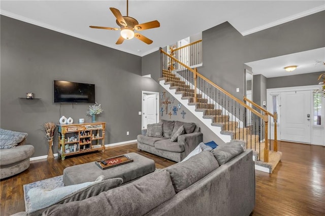23968 Eagle Ct, Paola, KS 66071 - living area featuring stairs, wood finished floors, a ceiling fan, and ornamental molding