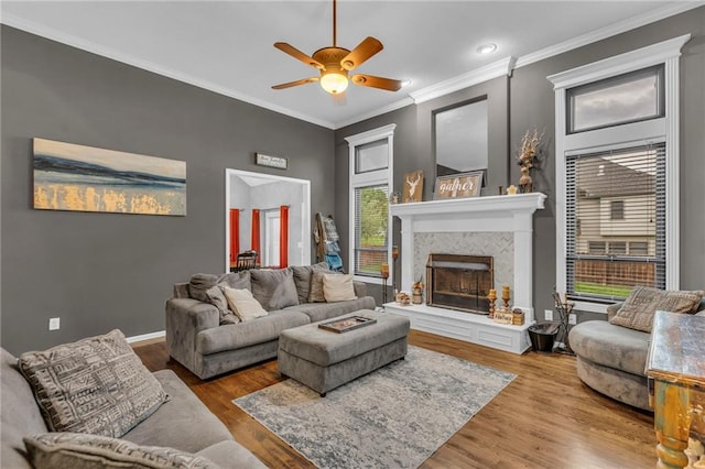 23968 Eagle Ct, Paola, KS 66071 - living room featuring ceiling fan, a fireplace with raised hearth, crown molding, wood finished floors, and recessed lighting