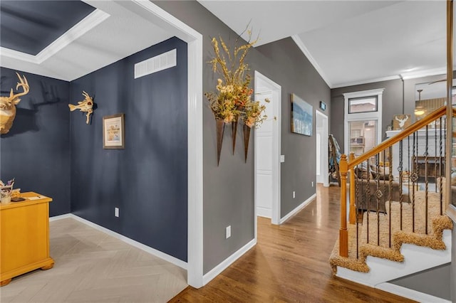 23968 Eagle Ct, Paola, KS 66071 - hallway featuring stairs, crown molding, and wood finished floors