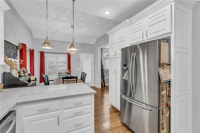 23968 Eagle Ct, Paola, KS 66071 - kitchen with stainless steel appliances, wood finished floors, white cabinets, a peninsula, and hanging light fixtures