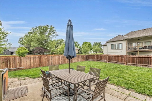 23968 Eagle Ct, Paola, KS 66071 - fenced backyard with a patio area and outdoor dining area