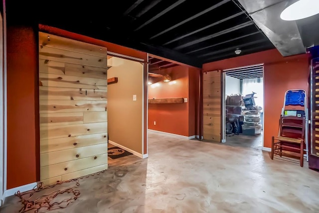 1229 Starbrooke Dr, Louisburg, KS 66053 - miscellaneous room with concrete flooring and baseboards