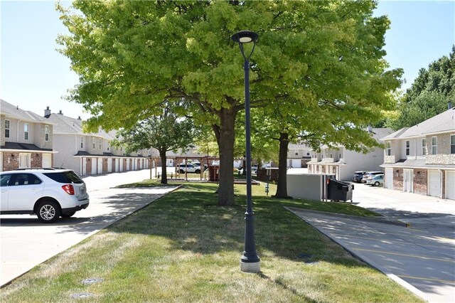 1529 E 120th St, Olathe, KS 66061 - view of home's community featuring a residential view and a lawn