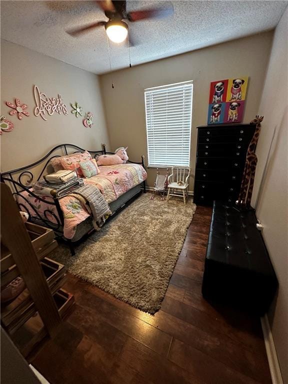 1529 E 120th St, Olathe, KS 66061 - bedroom featuring a textured ceiling, dark wood finished floors, and ceiling fan