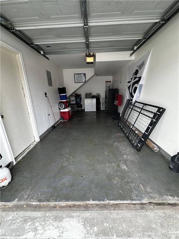 1529 E 120th St, Olathe, KS 66061 - garage featuring a garage door opener