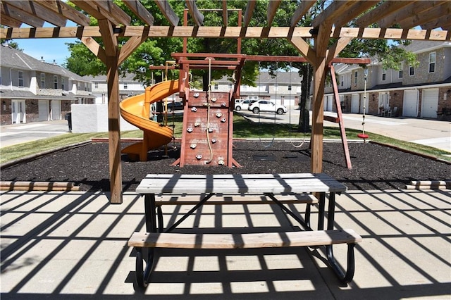 1529 E 120th St, Olathe, KS 66061 - view of patio / terrace with a playground, a pergola, and a residential view