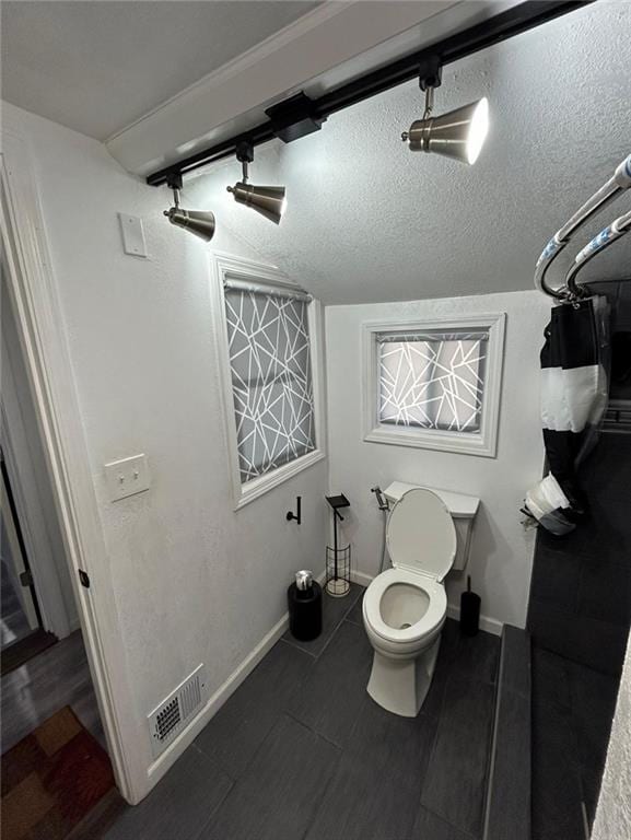 4123 E 6th St, Kansas City, MO 64124 - bathroom with toilet and baseboards