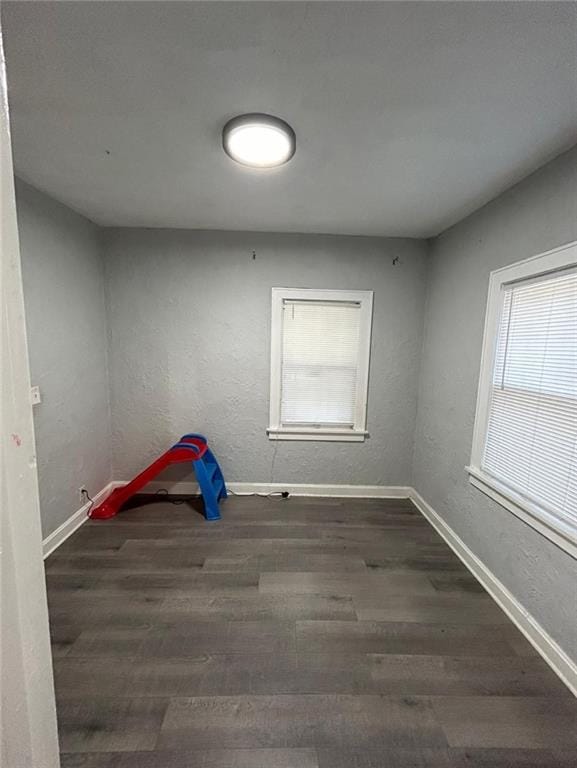4123 E 6th St, Kansas City, MO 64124 - unfurnished room featuring wood finished floors