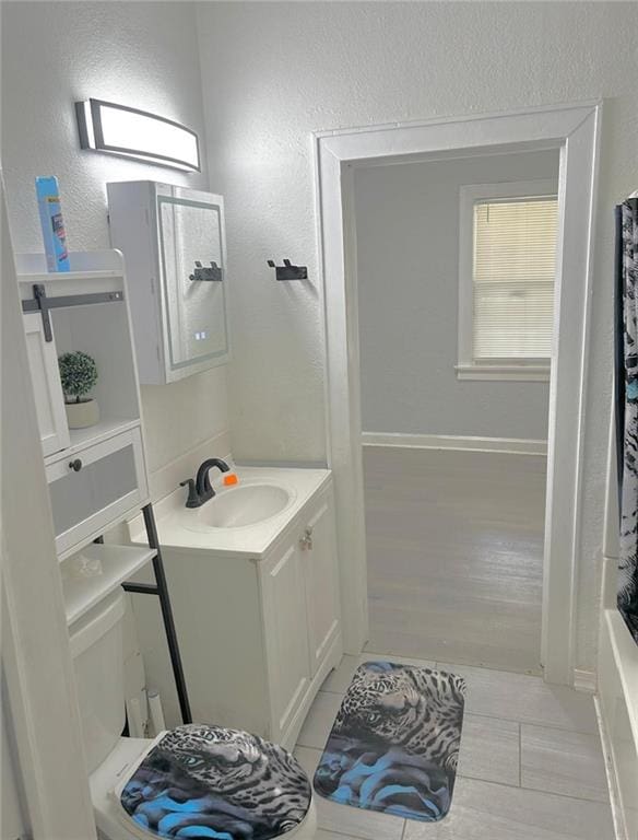 4123 E 6th St, Kansas City, MO 64124 - bathroom with vanity, tile patterned floors, and a textured wall