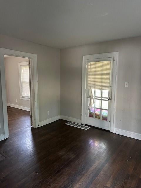 9600 E 16th St, Independence, MO 64052 - unfurnished room with baseboards and wood finished floors