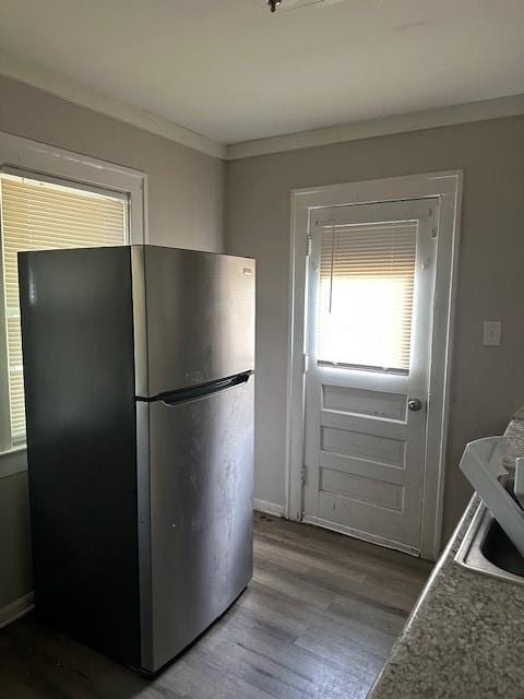 9600 E 16th St, Independence, MO 64052 - kitchen featuring freestanding refrigerator, dark wood-style floors, and crown molding