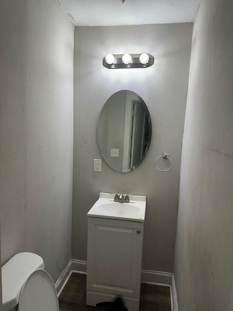 9600 E 16th St, Independence, MO 64052 - bathroom with vanity and wood finished floors