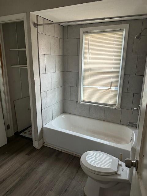 9600 E 16th St, Independence, MO 64052 - full bath with wood finished floors and bathtub / shower combination